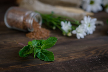 Flax seeds on a dark wooden background