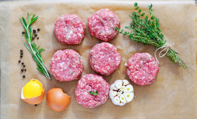 chopped steaks with rosemary, garlic, egg and thyme