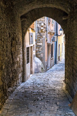 Fototapeta premium The historic street with underpass. Piran town on Adriatic sea, one of major tourist attractions in Slovenia, Europe.