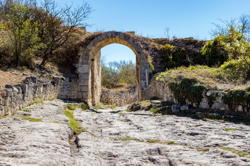 Fototapeta na wymiar Chufut-Kale. Medieval city-fortress in the Crimean Mountains, Bakhchysarai. Orta-Capua Gate 