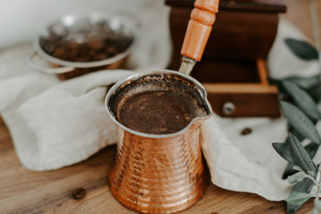 Fresh Turkish coffee in a copper in rural scene
