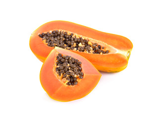 cut ripe papaya with seeds on white background
