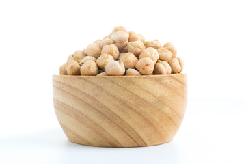 chickpeas in wood cup isolated on white
