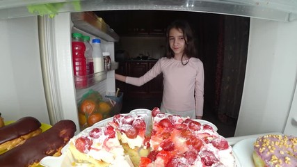 girl teenager opens the refrigerator at night. night hunger. diet. gluttony, 4k