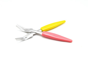Small forks for fruit on white background