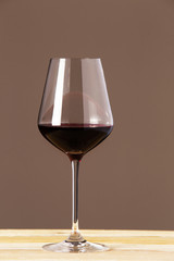 One wineglass with red wine