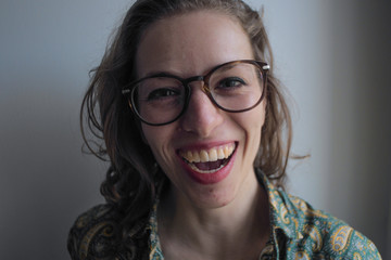 closeup portrait of a optimistic caucasian woman on white background