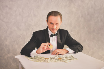 Concept Very wealthy businessman. Businessman is happy with his money.A businessman showing his...