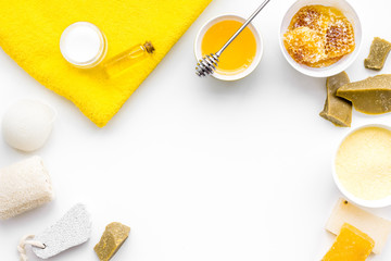 Aromatic theraphy and delicate skin care. Spa set based on honey on white background top view copy space