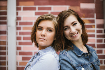 Cute Attractive Young Woman Modeling on Brick Wall