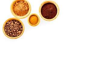 Ground seasoning for cooking desserts. Cinnamon, cocoa, coffee powder on white background top view copy space