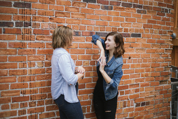 Cute Attractive Young Woman Modeling on Brick Wall