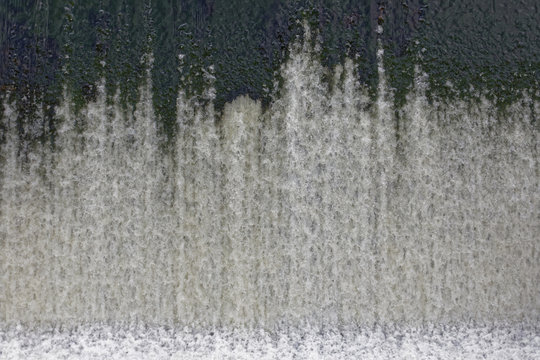 Water pouring down from a dam © Brian