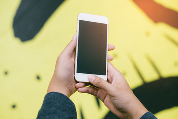 Woman use mobile phone in the city