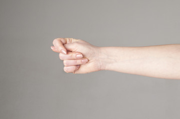 Fico gesture of a hand on a white background