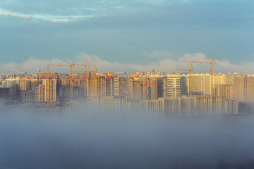 fog in city on construction site