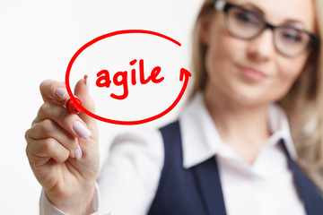 Business woman writing something with a marker or pen.Agile