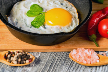 Fried eggs in a frying pan. Rustic breakfast