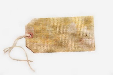 Burlap tag or label with attached string on white with room for text