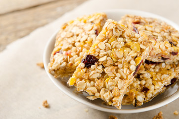 Bars of muesli in a bowl, rustic style. Useful food, dietary, vegetarian breakfast