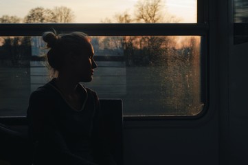 caucasian woman traveling by train