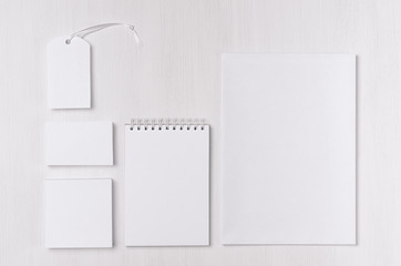 Branding business mock up of white blank stationery set on light soft white wooden background. Template for branding, business presentations and portfolios.