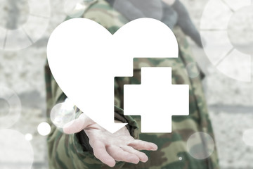 Soldier offers heart with medical cross icon on a virtual interface. Military Security and Protection Civilians. Military Hospital. Soldiers and People Health Care Safety.