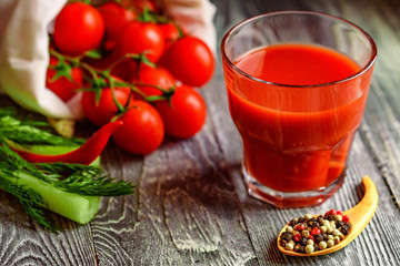 Glass of tomato juice with fresh tomatoes