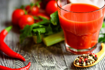 Glass of tomato juice with fresh tomatoes