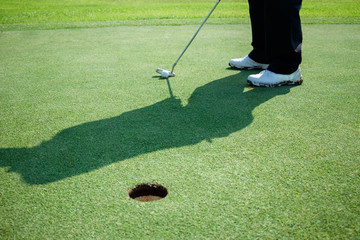 Man playing golf on a golf course.