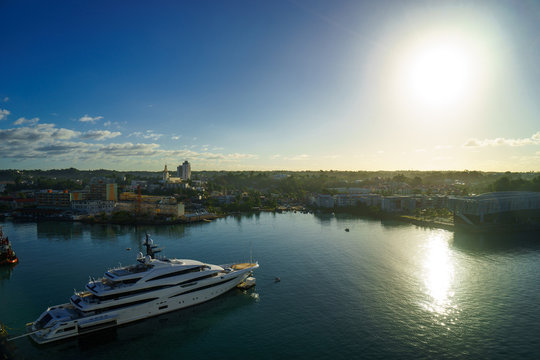 Huge motor boat in the port of Pointe-a-Pitre, with beautiful city on background Guadeloupe