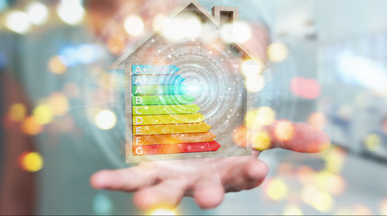 Businesswoman using 3D rendering energy rating chart in a wooden house