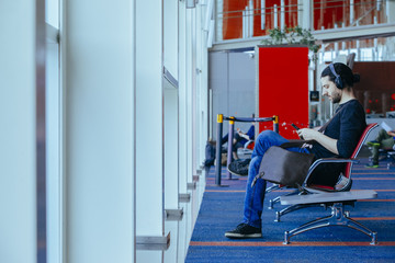 traveler young man doing remote working at the airport