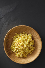 Fresh ginger granules in wooden plate