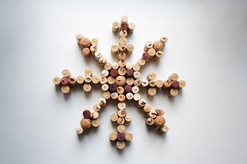 Wine corks snowflake abstract composition isolated on white background from a high angle view