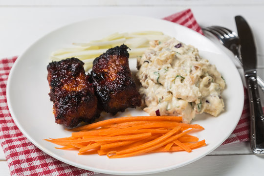 Pork ribs with American potato salad and carrot