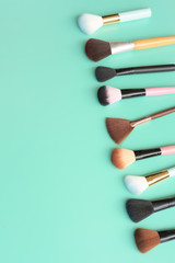 Naklejka premium Set of makeup brushes for background