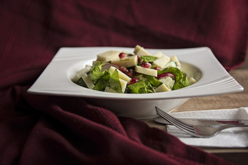 Green salad with cheese and pomegranate