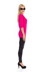 Fototapeta premium Beautiful Blond Woman Is Looking At Camera. Side View. Isolated On White