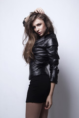 Beautiful girl in studio with brown long hair