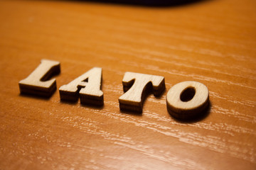 The polish word 'lato' made of wooden letters. wood inscription on table © daily_creativity