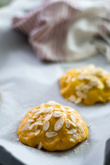 Baking saffron cookies with almond flakes