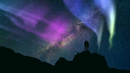 The couple standing on a rock against stars with a northern light. time lapse - Powered by Adobe