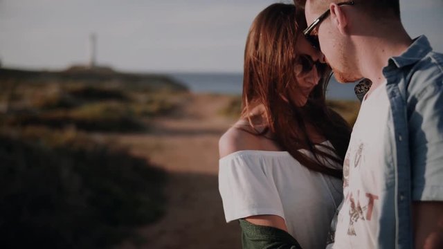 Loving happy and very beautiful couple walking in nature 
