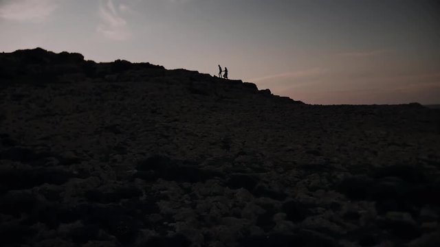 Beautiful couple in love at sunset 