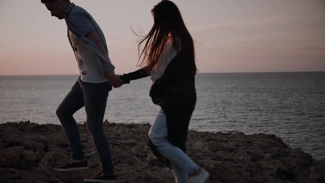 Loving happy and very beautiful couple walking in nature 