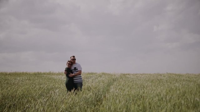 Loving happy and very beautiful couple walking in nature 