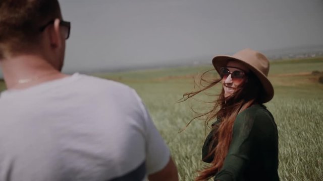Loving happy and very beautiful couple walking in nature 