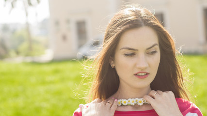 Portrait of pretty girl with chamomile chaplet