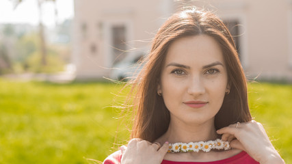 Portrait of pretty girl with chamomile chaplet